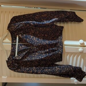 Blouse with full sleeves and elasticized waist.